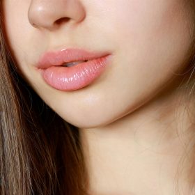 a close up of a woman with long brown hair